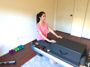 Start sitting tall, core engaged, with hands on the box.